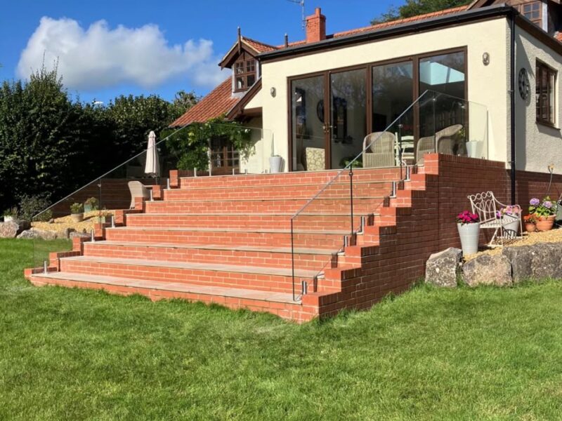 Completed Chew Stoke home extension with brick garden steps, glass balustrades and handrails by Lees Builders