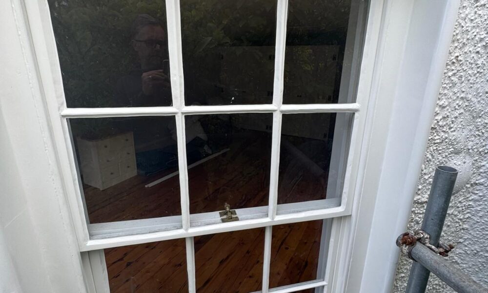 Restored timber sash window on period property by Lees Builders Ltd