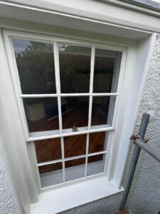 Restored timber sash window on period property by Lees Builders Ltd