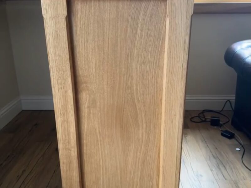 Panelled oak bar end with a thick solid oak worktop