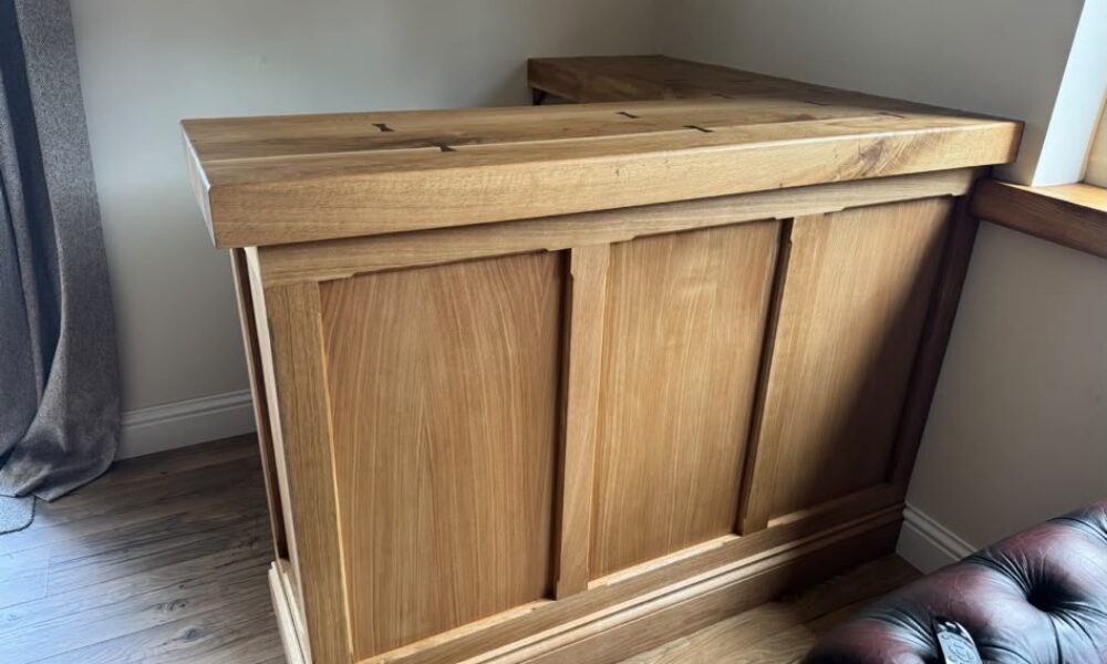 Finished bespoke oak bar with panelled front and solid oak top in Hutton