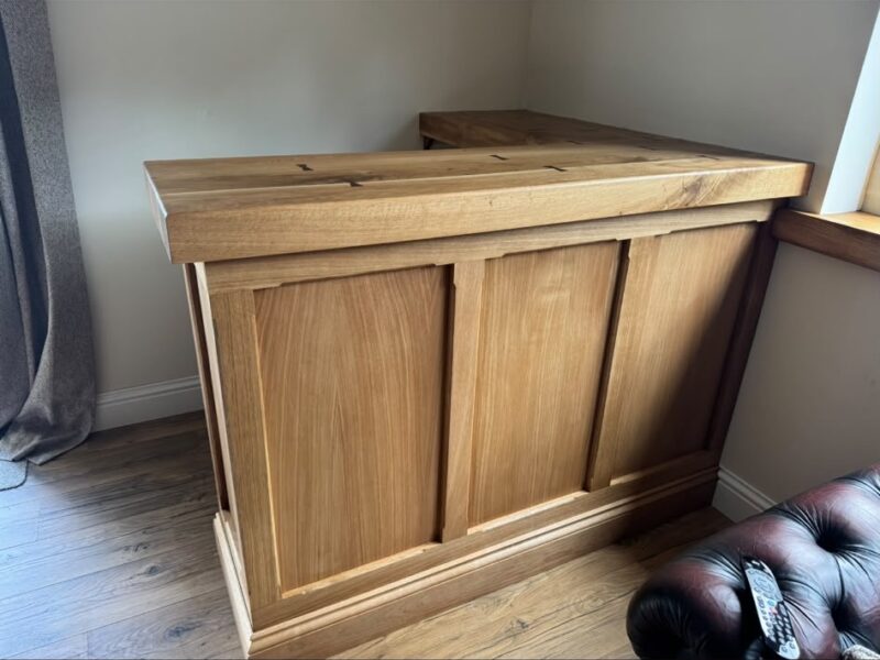 Finished bespoke oak bar with panelled front and solid oak top in Hutton